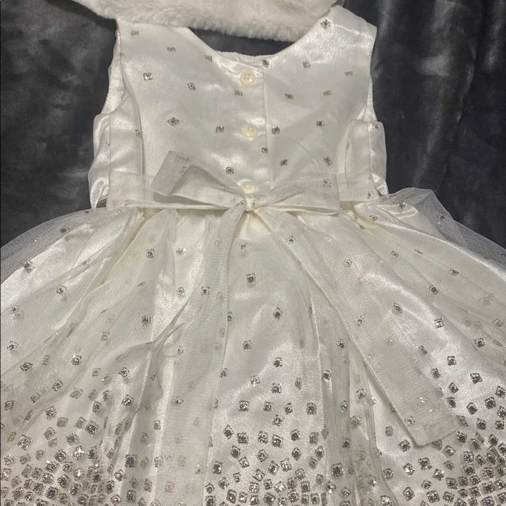 Jona Michelle, Elegant Ivory dress with Gold Bow.